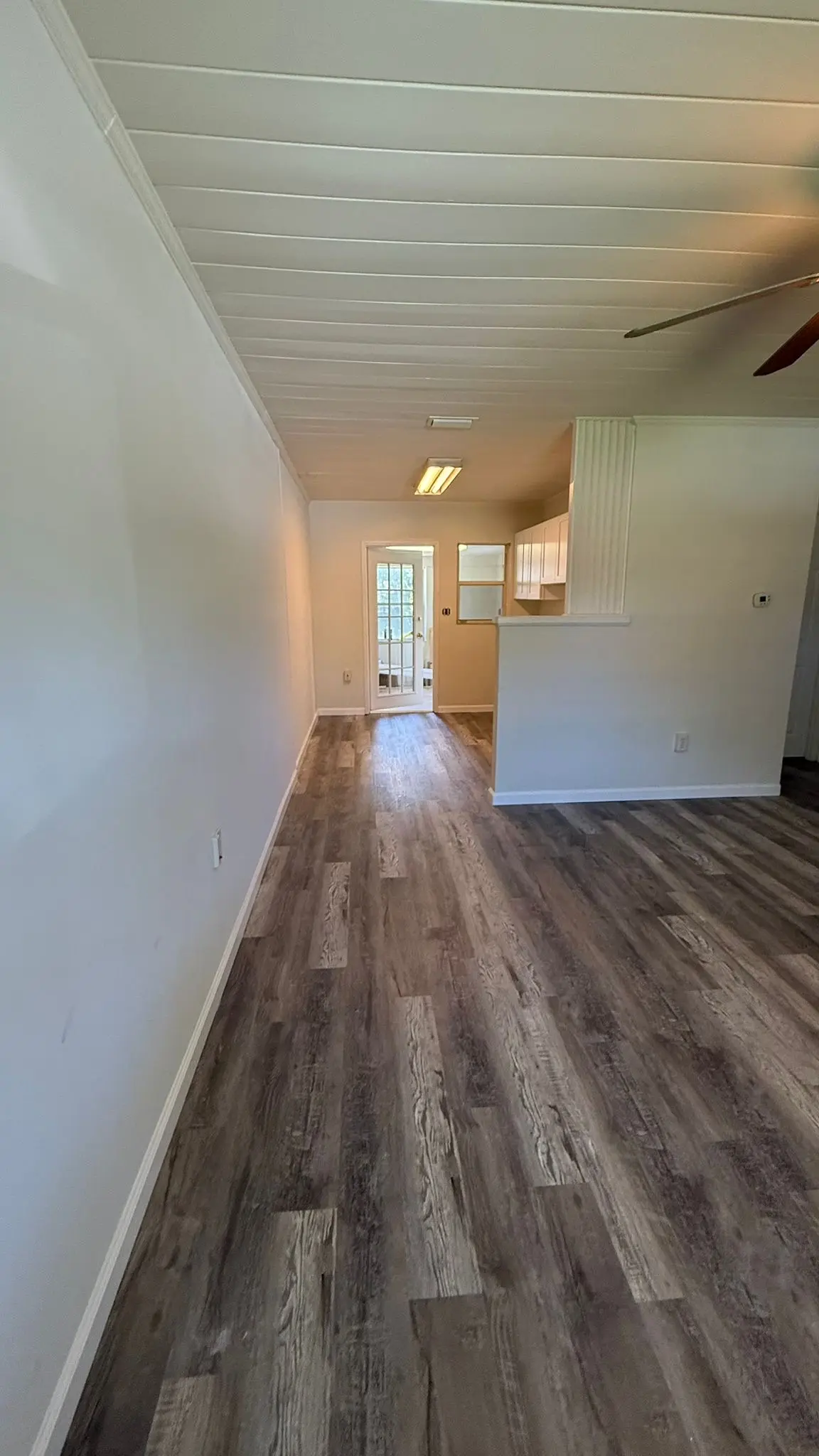 Finished LVP flooring project with baseboards