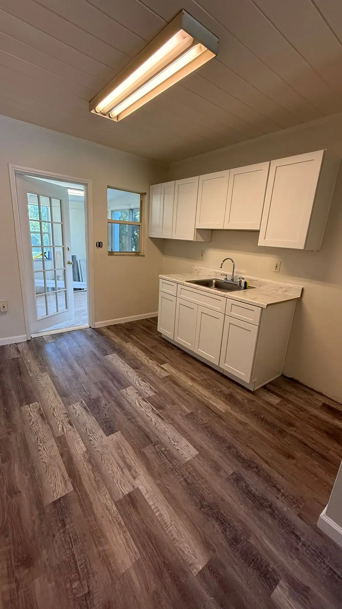Room completed with LVP flooring and trim