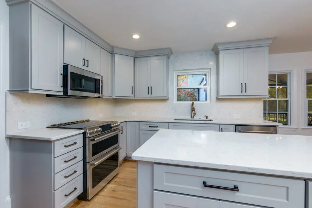 White shaker kitchen cabinets with modern hardware after cabinet painting