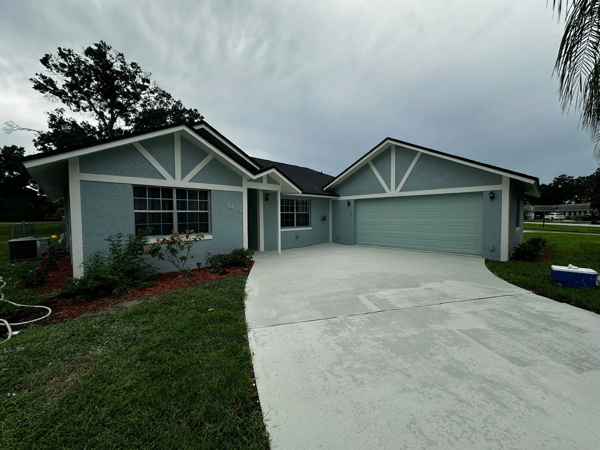 Single-story home exterior after painting with fresh trim contrast